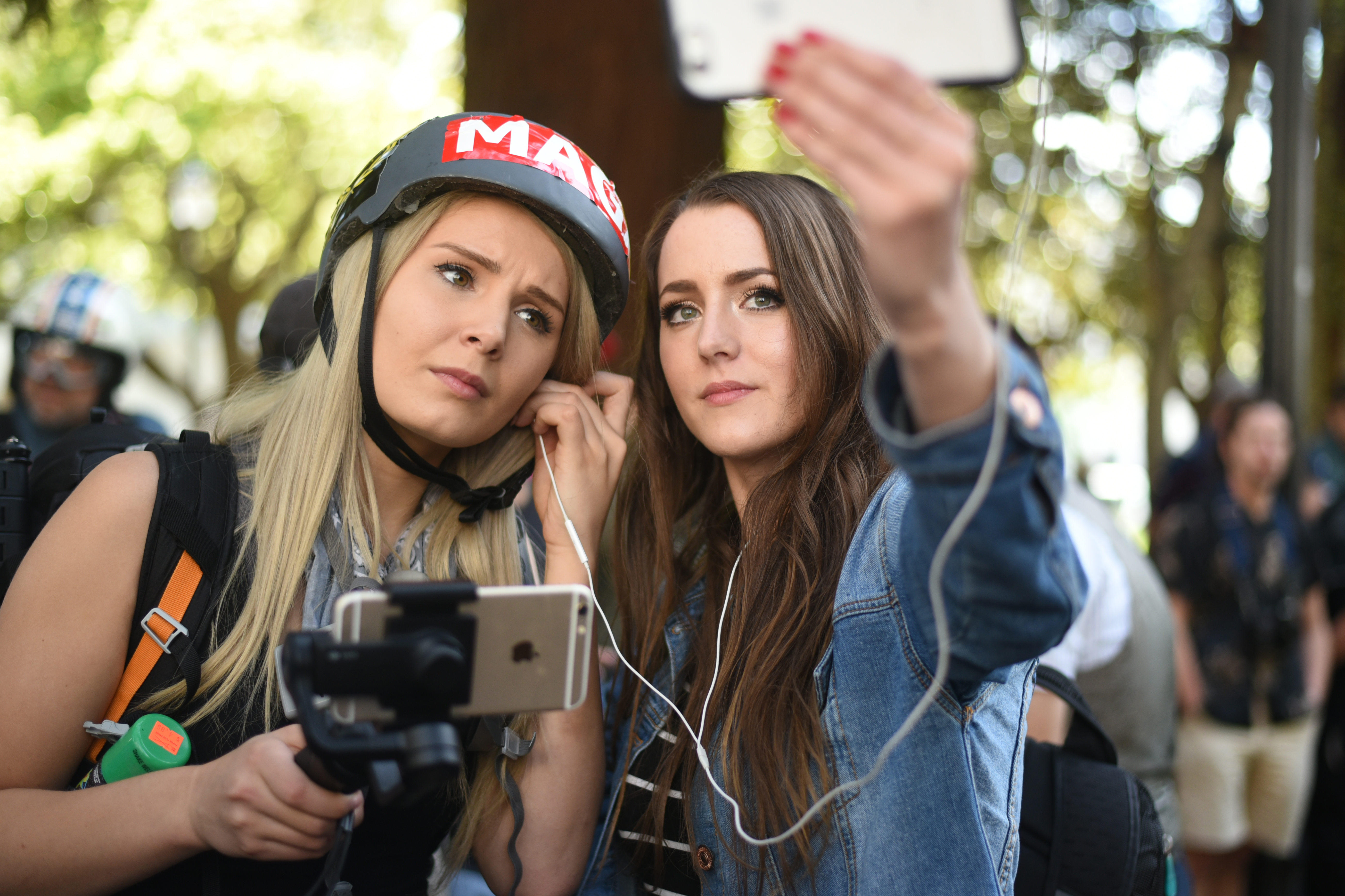 Berkeley, California, USA. 27th Apr, 2017. Alt-right videocasters LAUREN SOUTHERN and BRITTANY PETTIBONE broadcast from the sight of an alt-right ''MAGA'' rally at Berkeley's Civic Center Park. Conservative media personality Ann Coulter had originally bee